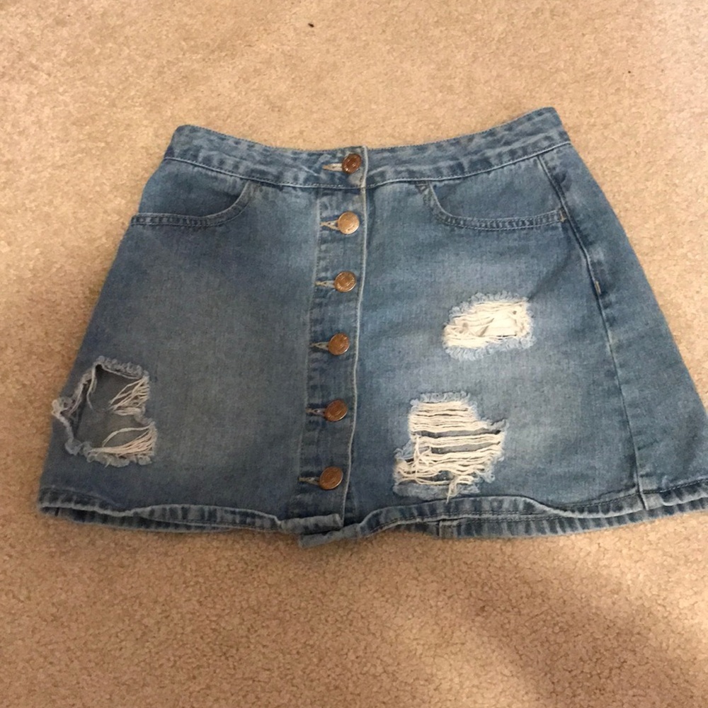 Light wash denim mini skirt with rips